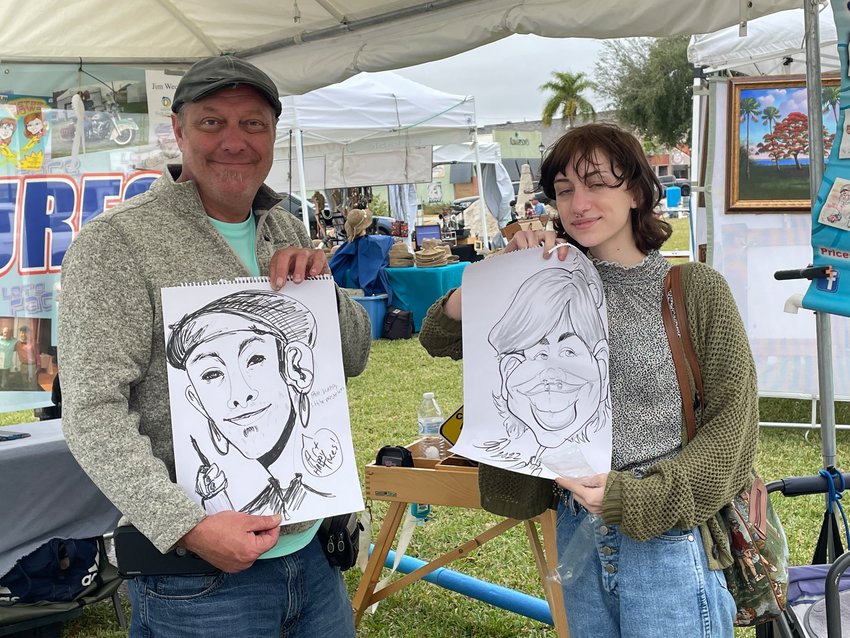Jim Weckbacher has been doing caricatures for many years. Beautiful Smith drew her first on at the art fest on Saturday.