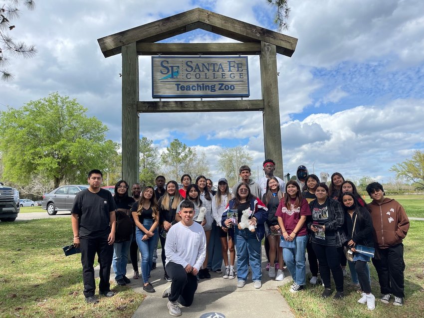 Immokalee Foundation juniors pose for a photo at Santa Fe College's Teaching Zoo.