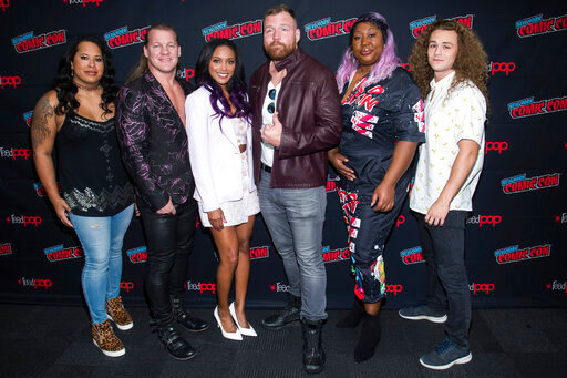 FILE - In this Friday, Oct. 4, 2019, file photo, Nyla Rose, from left, Chris Jericho, Brandi Rhodes, Jon Moxley, Awesome Kong and Jungle Boy attend New York Comic Con to promote TNT's "All Elite Wrestling: Dynamite," at the Jacob K. Javits Convention Center, in New York. All Elite Wrestling is set to celebrate its one-year anniversary with a show from Daily’s Place in Jacksonville, Fla., on Wednesday, Oct. 14, 2020. (Photo by Charles Sykes/Invision/AP, File)