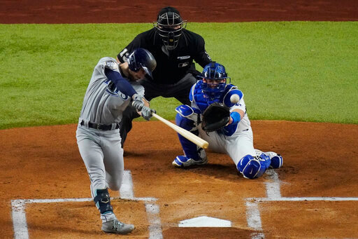 Tampa Bay Rays' Brandon Lowe hits a home run against the Los Angeles Dodgers during the first inning in Game 2 of the baseball World Series Wednesday, Oct. 21, 2020, in Arlington, Texas. (AP Photo/Sue Ogrocki)