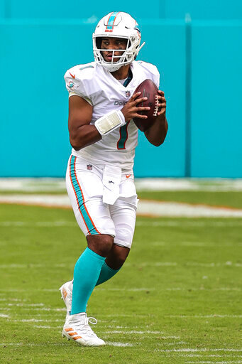 Miami Dolphins quarterback Tua Tagovailoa (1) looks downfield for a receiver in an NFL game against the Los Angeles Rams, Sunday, Nov. 1, 2020 in Miami Gardens, Fla. The Dolphins defeated the Rams 28-17. (Margaret Bowles via AP)