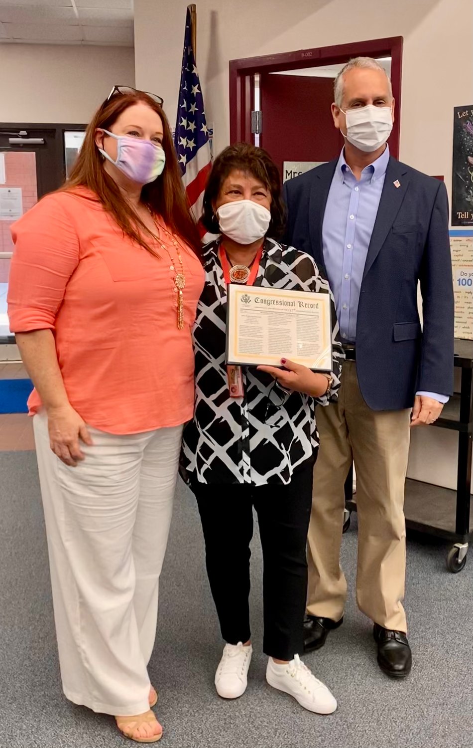 School Board Member, Stephanie Busin (left) and Congressman Mario Diaz-Balart, congratulate Margarita Nelson (middle) on being the 2021 South Florida Women’s History Month honoree.
