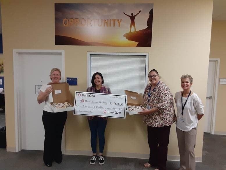 Goodwill Industries of Southwest Florida issues a $1,000 grant to Shannen Leahy, owner of a micro-bakery based in Hendry County. In the group picture is left to right: Keitha Daniels – Director at Hendry County Economic Development Council, Shannen, Sandra Plazas – Program Manager and  Dorothy Browning – MicroEnterprise Program Coordinator