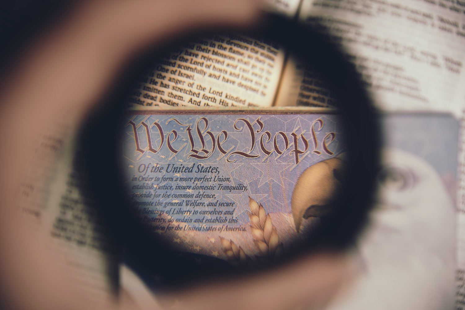 "We the People" phrase from the Constitution Preamble in focus.