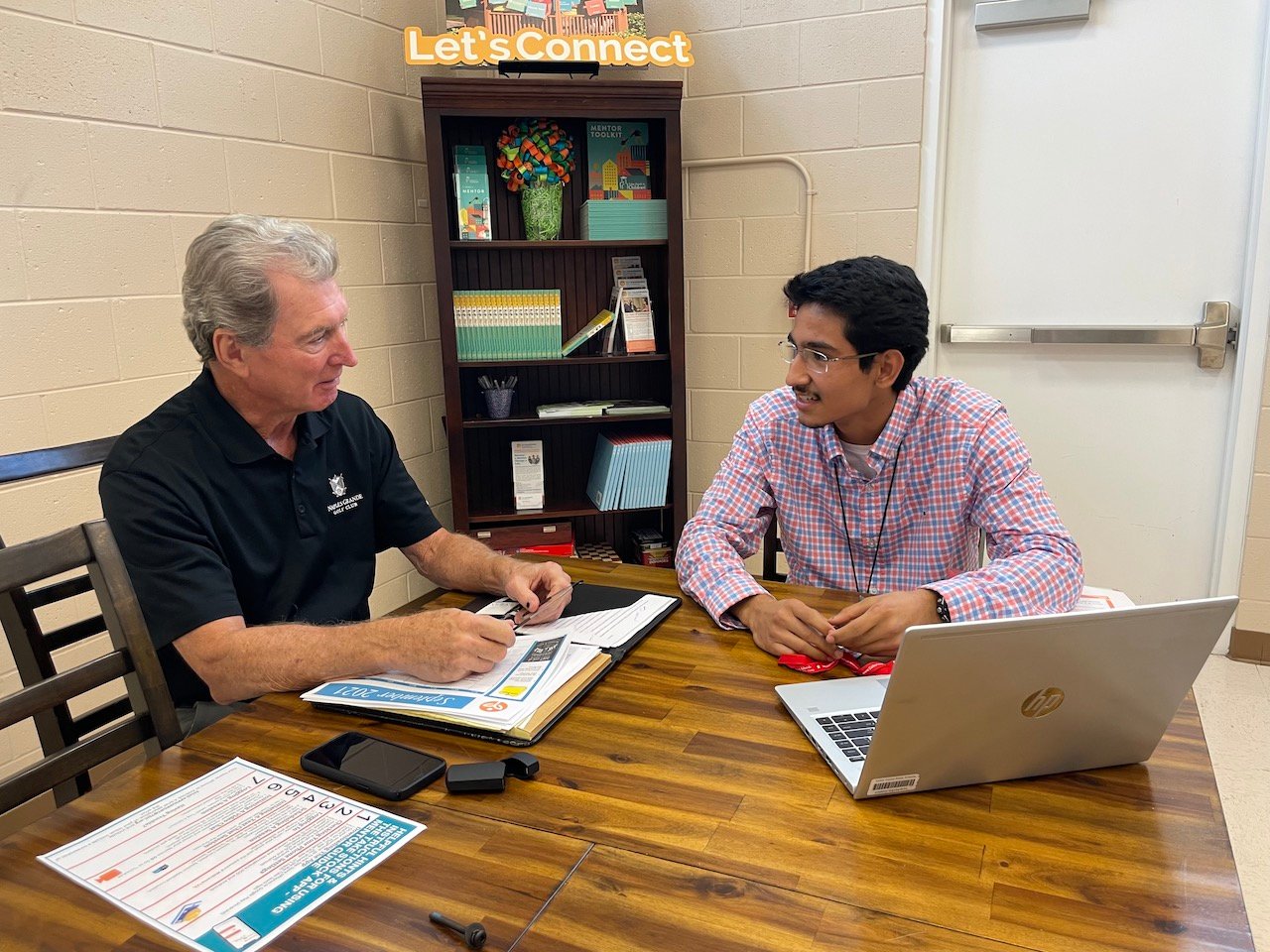 Jerry Belle, Chairman of the Board for The Immokalee Foundation, with Joel during a mentor session. As part of Take Stock in Children, students meet with a mentor once a week for at least 30 minutes.