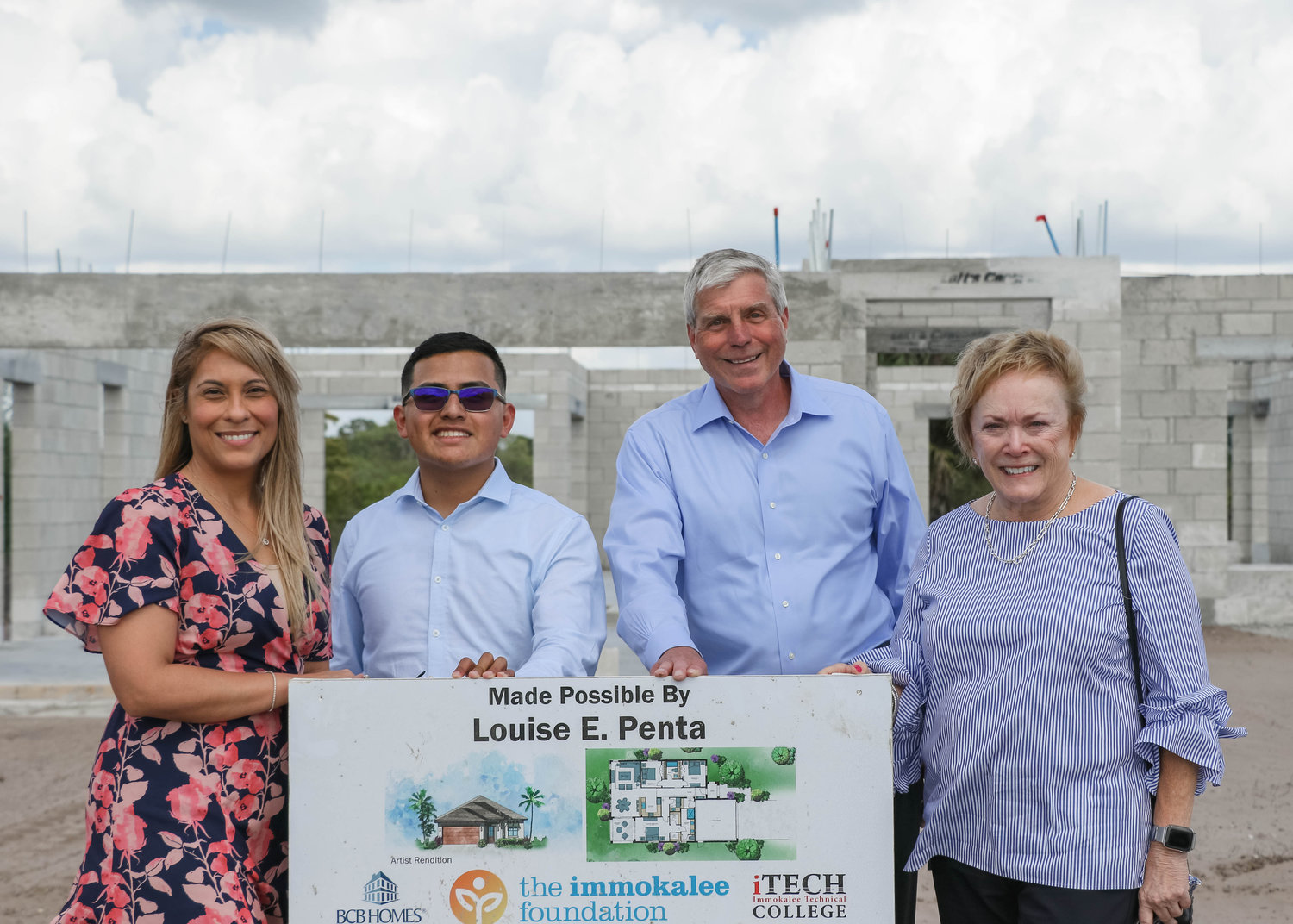 Immokalee Foundation President and CEO Noemi Y. Perez, Engineering & Construction Management Pathway alumni Daniel Trejo, Operations Director Walt Buchholtz, and Louise Penta in front of The Career Pathways Learning Lab she underwrote.