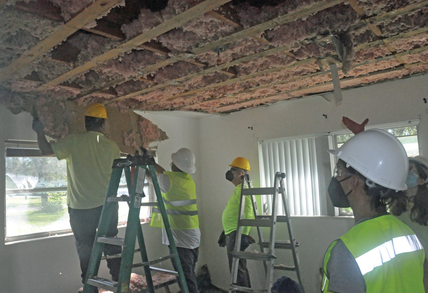 Insulation in the ceiling of the home of Richard and Janet Shuette had to be pulled down to allow it to dry after damage from Hurricane Ian.