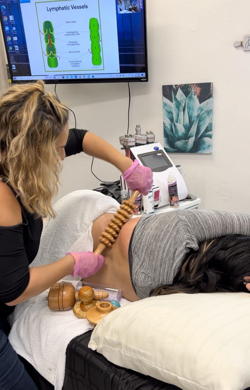 Salon Eight Four owner Letty Balderas (left) gives a customer a massage treatment.